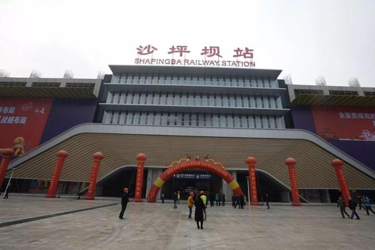 a large building with people standing outside of it