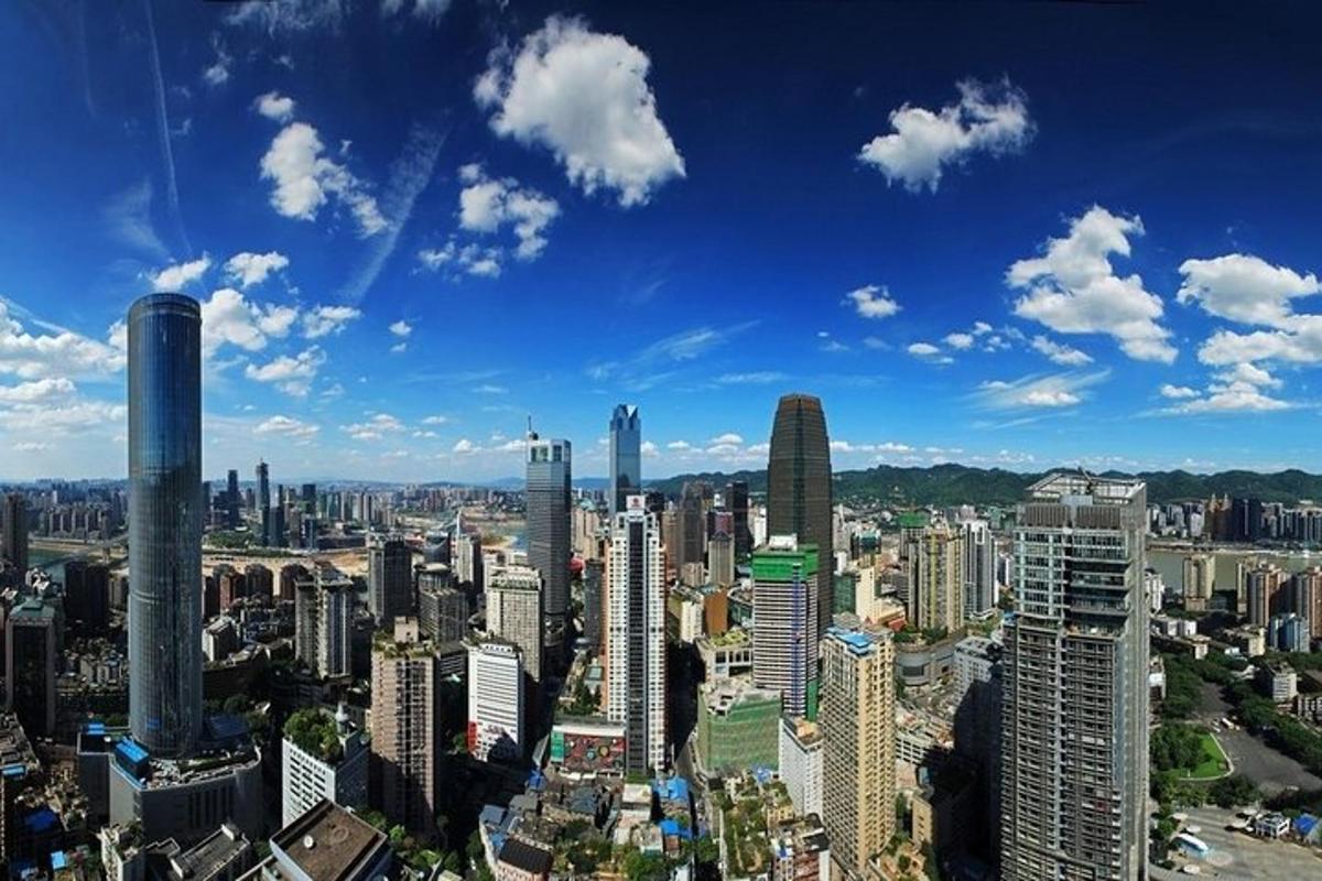 an aerial view of a city with tall buildings