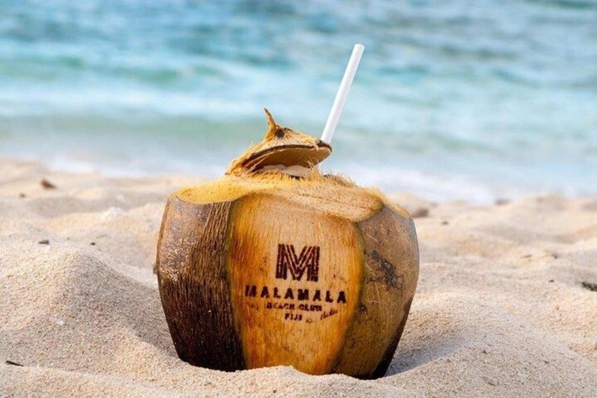 a drink in the sand on the beach