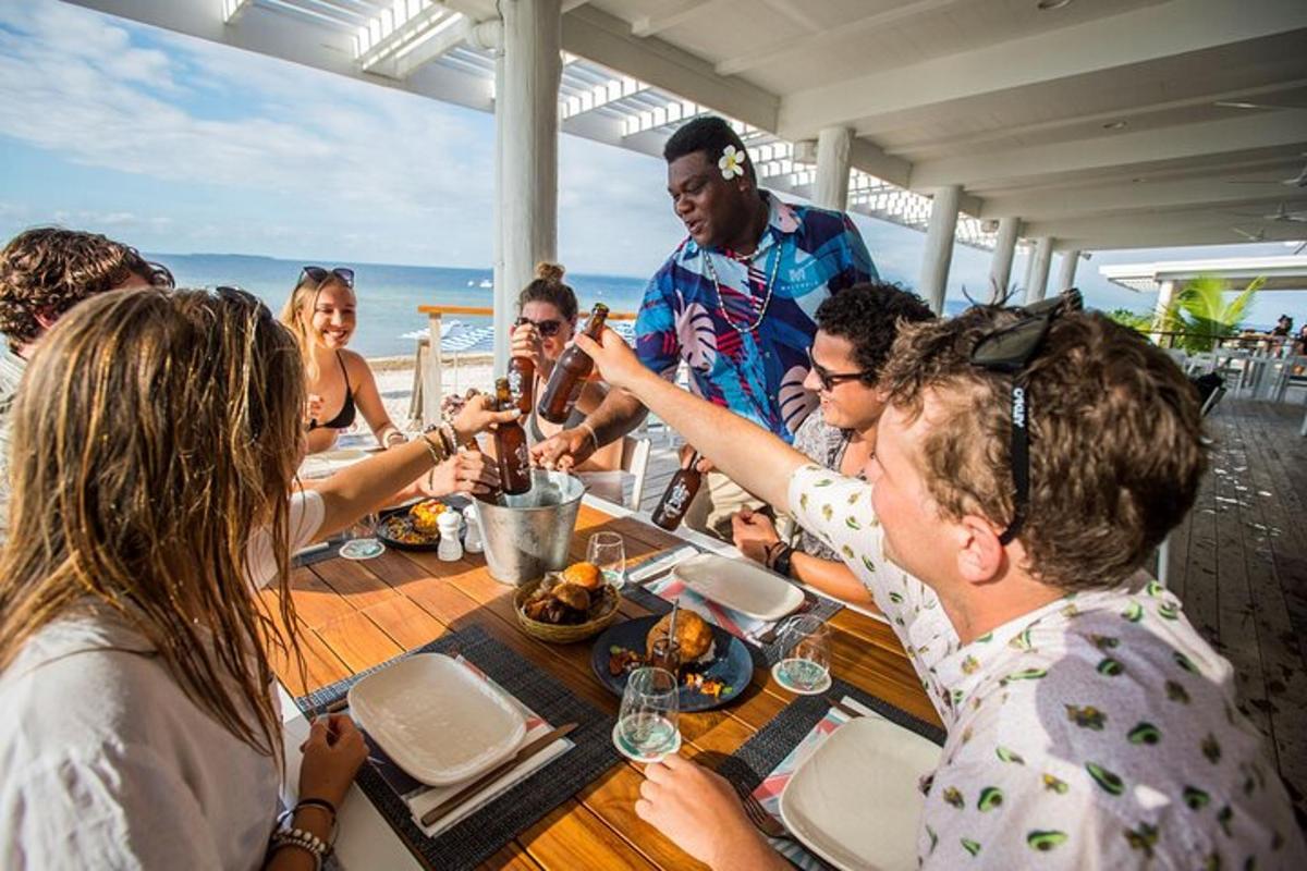 a group of people sitting around a table eating