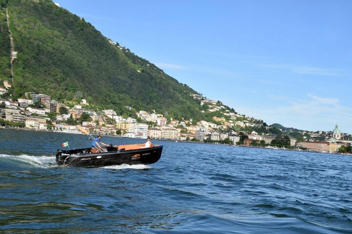 a boat on the water with a city in the background
