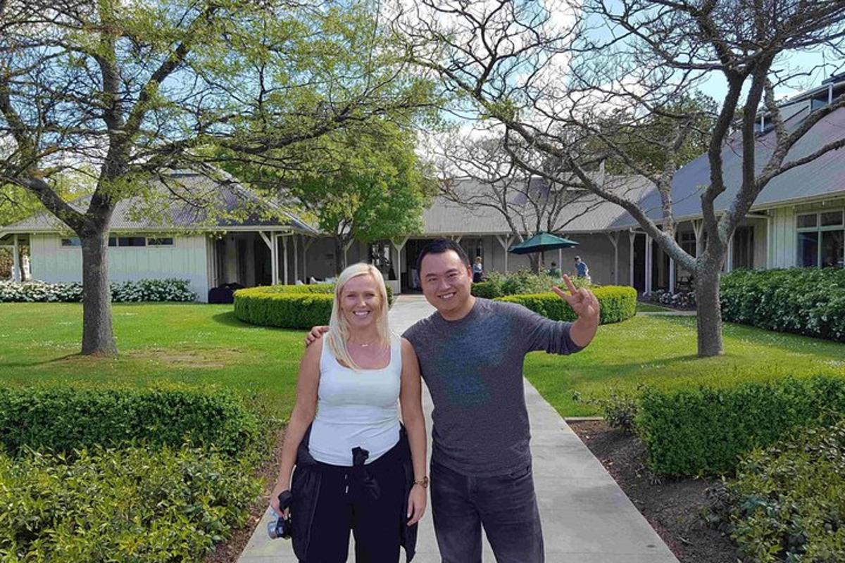 a man and a woman standing on a sidewalk