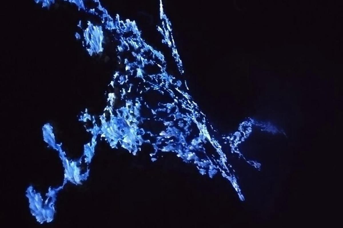 a blue light up object in the sky