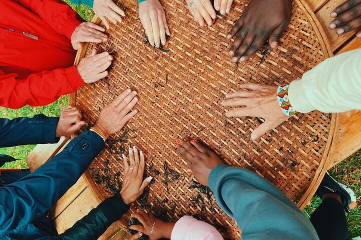a group of people sitting around a table with their hands
