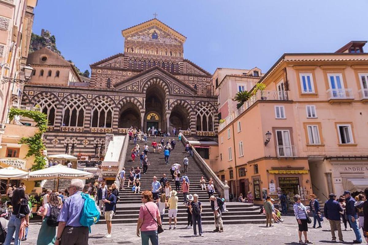 a group of people walking in front of a building