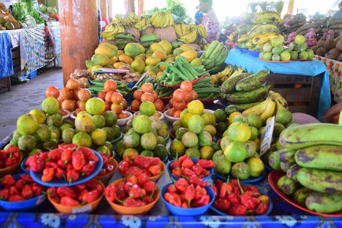 a market with many different fruits and vegetables on display