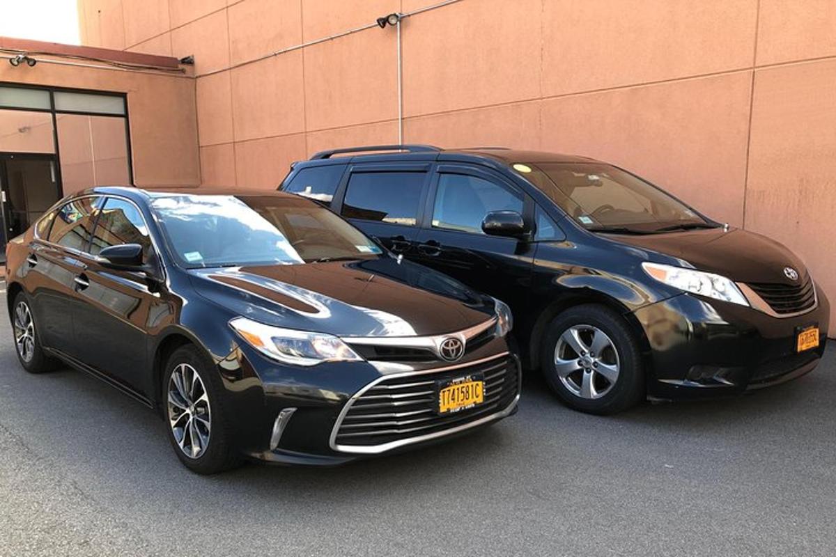 two cars parked next to each other on a street