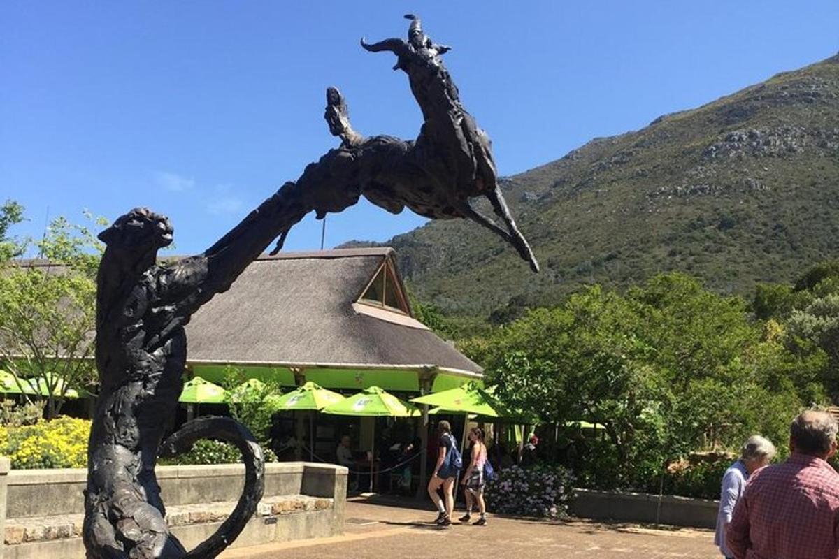 a statue of a mermaid in front of a restaurant