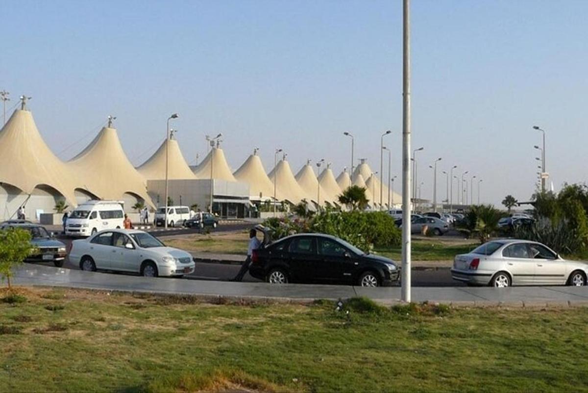 a group of cars parked in a parking lot