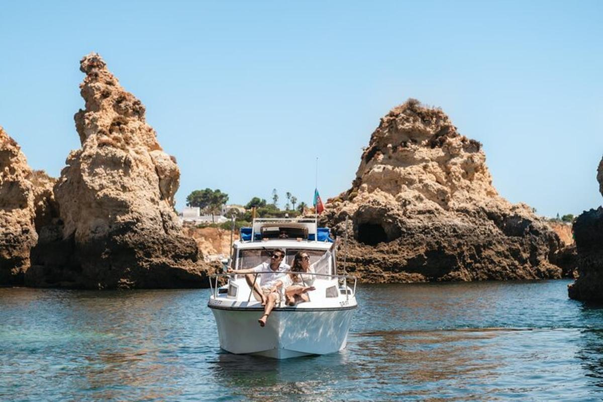 two people sitting on a boat in the water