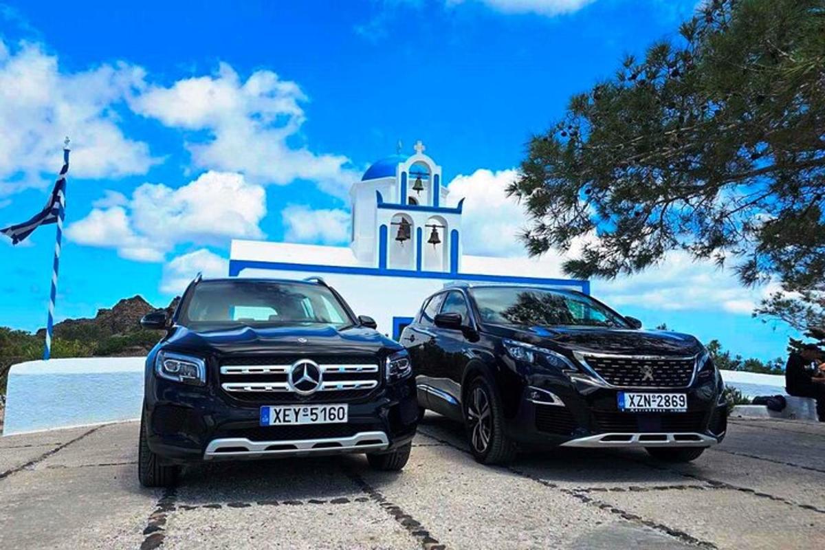 two cars parked in front of a church