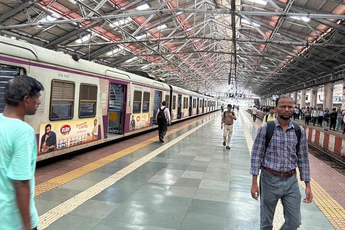 a group of people walking in a train station