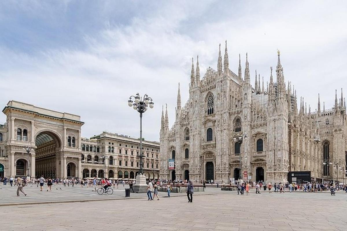 a large cathedral with people walking in front of it