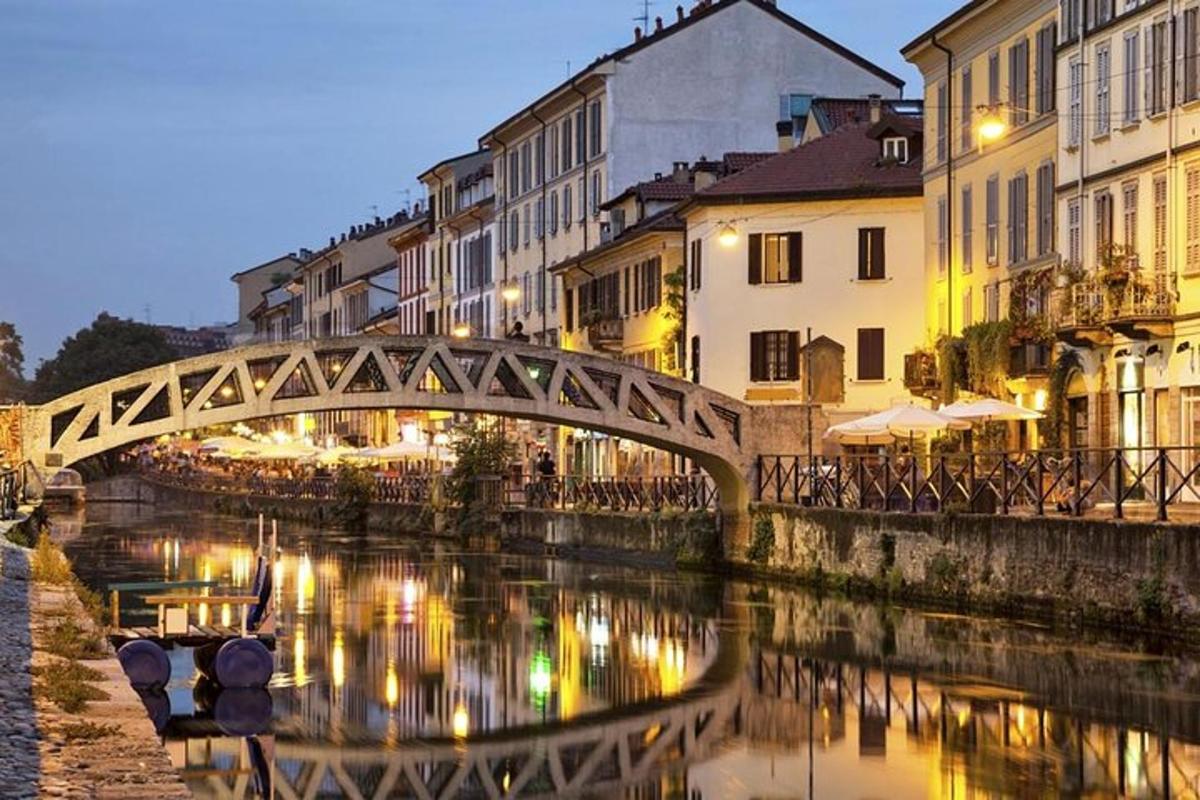 a bridge over a river in a city at night