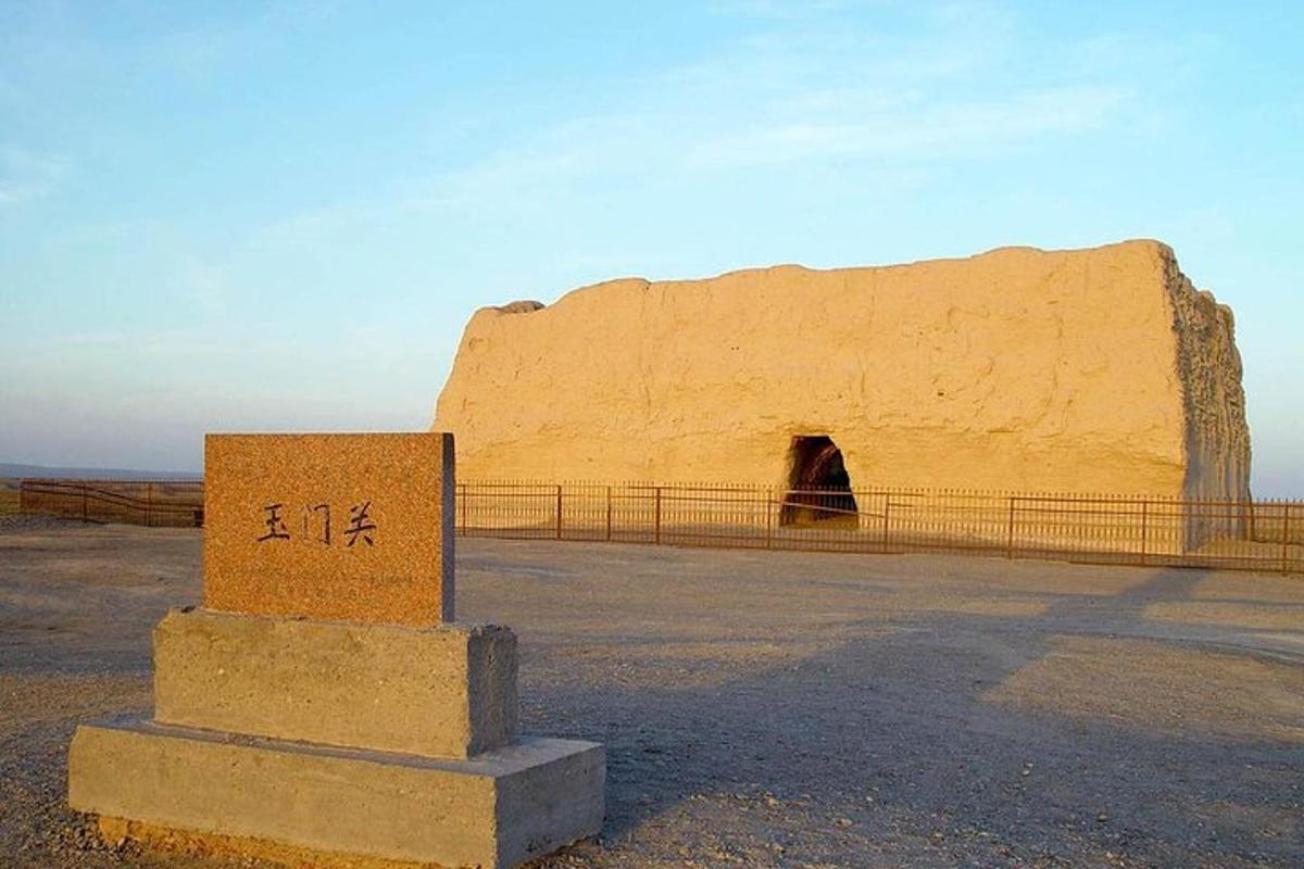 a stone monument in front of a rock formation