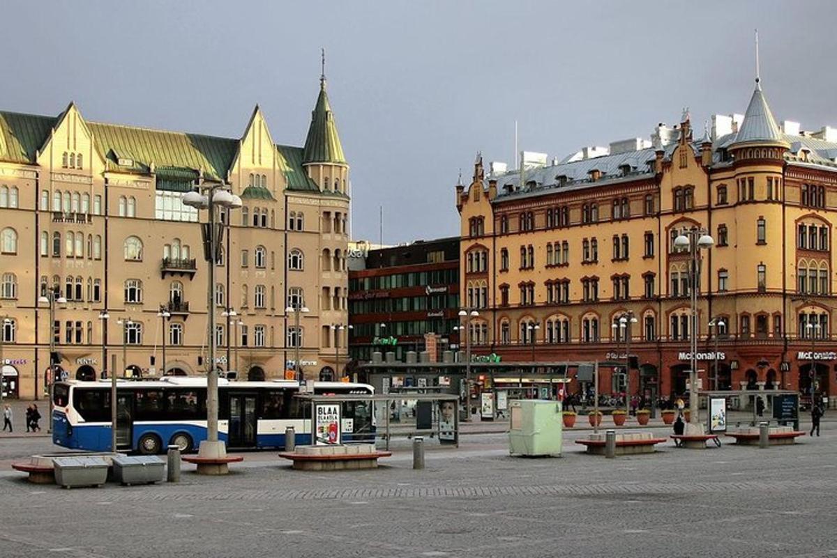 a bus is parked in front of some buildings