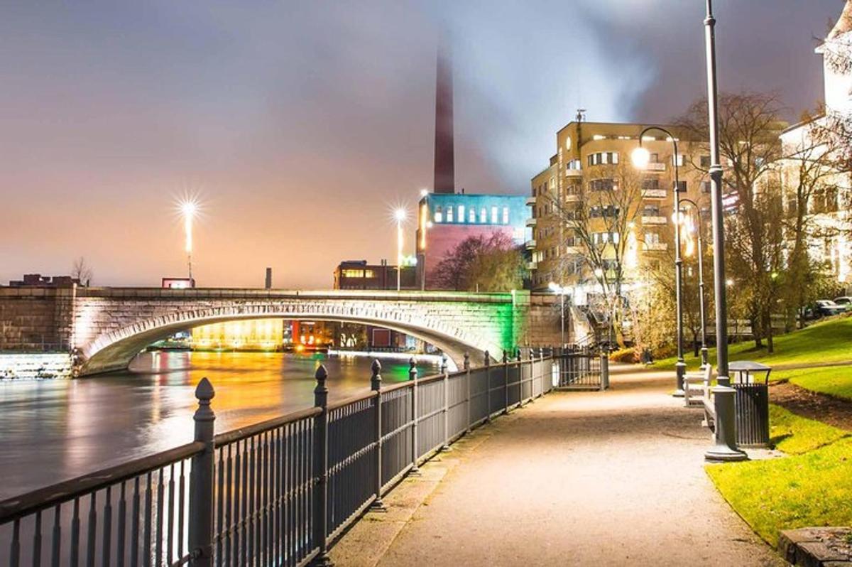 a bridge over a river in a city at night