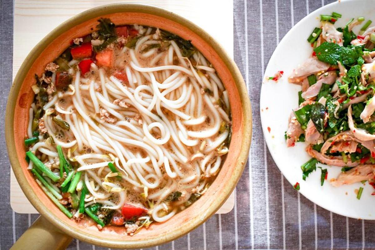 a bowl of noodles and a plate of food