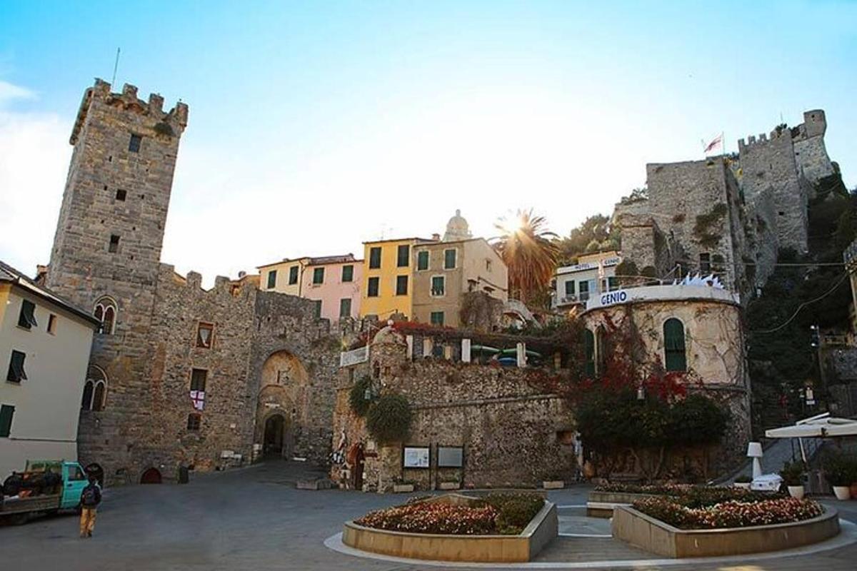 an old stone building with a tower in a courtyard