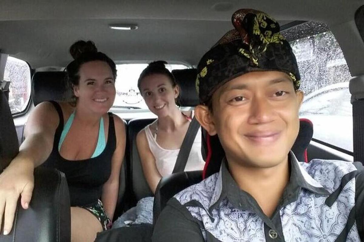 a group of people sitting in a car
