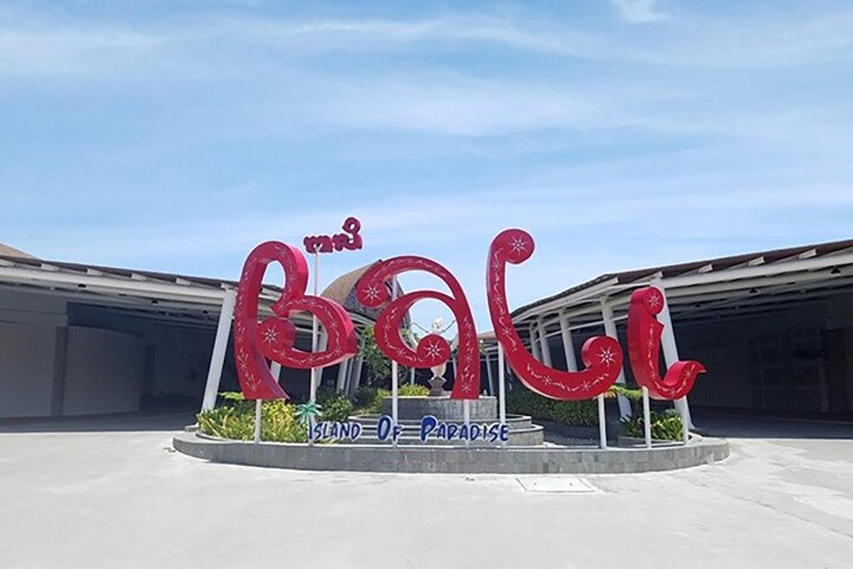 a large red sign in front of a building