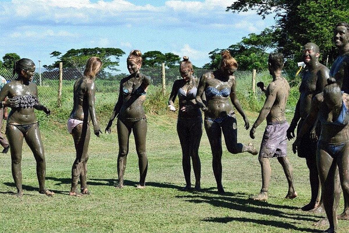 a group of naked people standing in a field