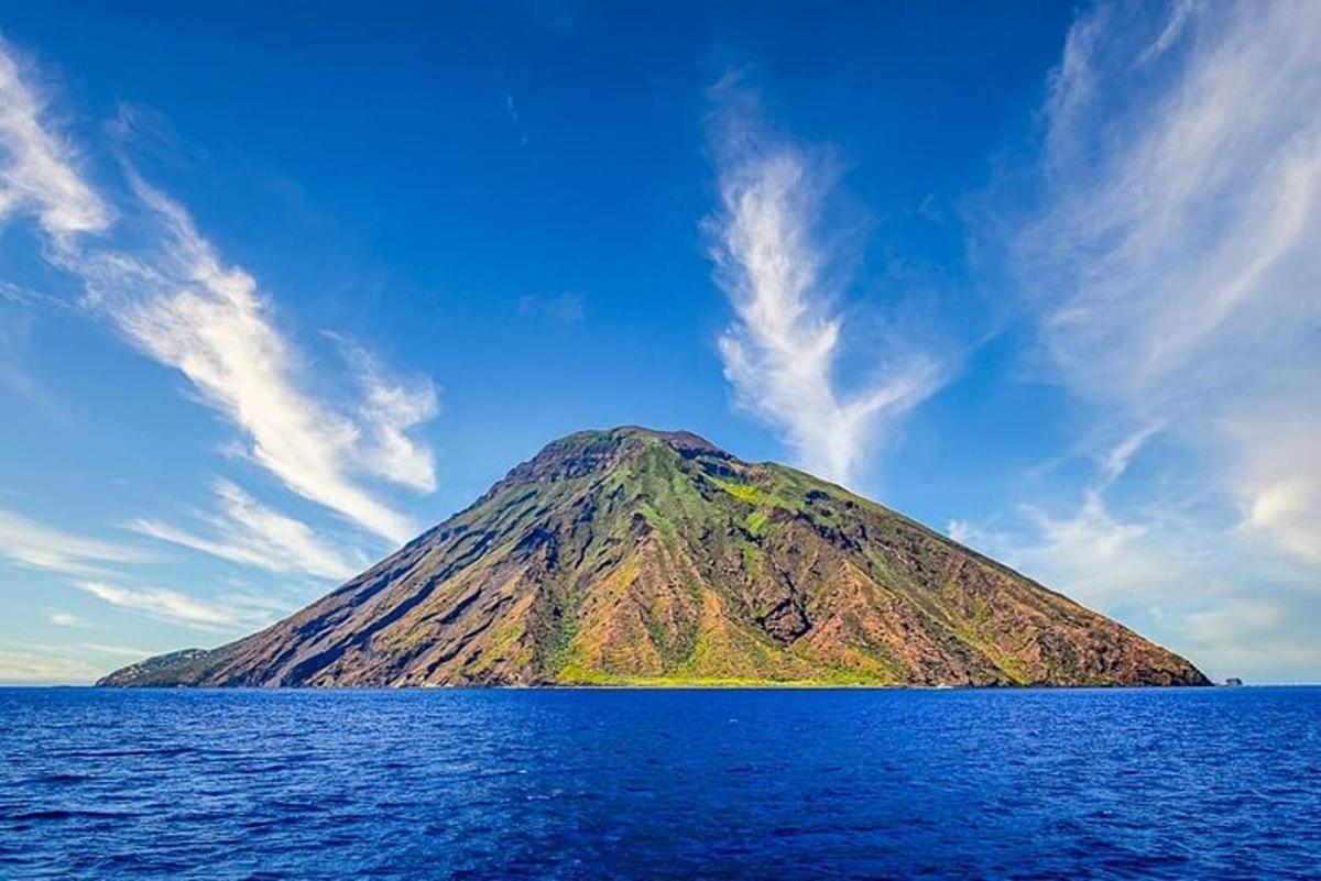a mountain in the middle of a body of water