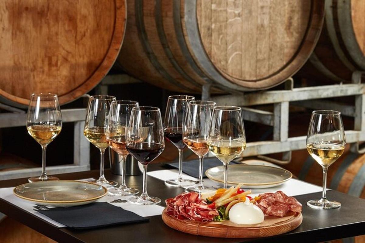 a table with wine glasses and a plate of food