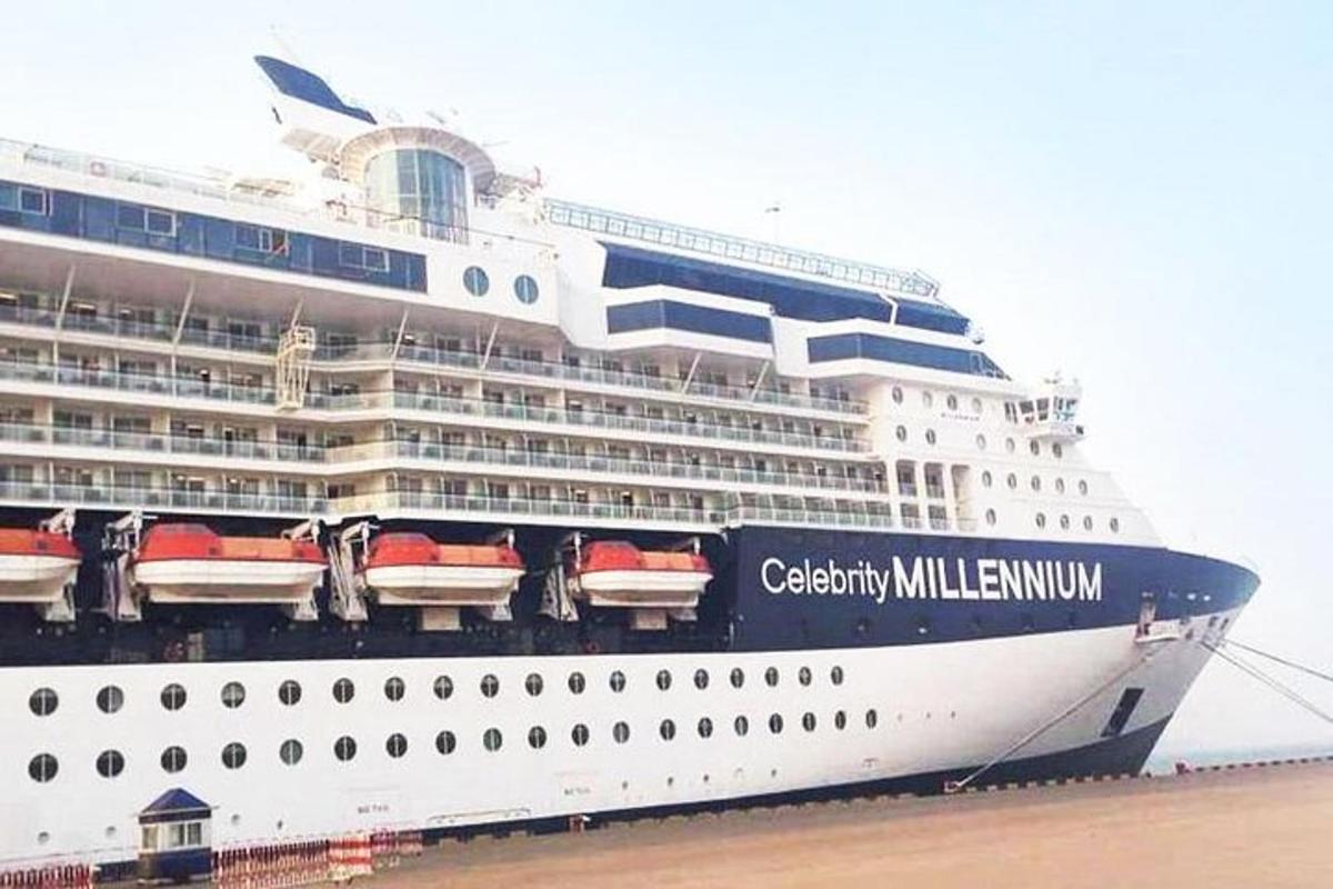 a cruise ship is docked at the beach