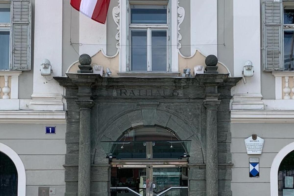 an entrance to a building with a flag