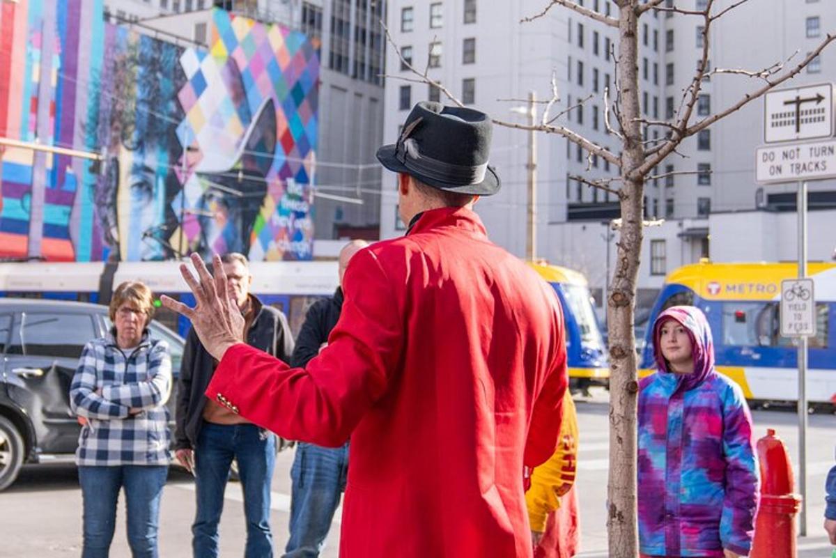 a man wearing a top hat standing on a city street