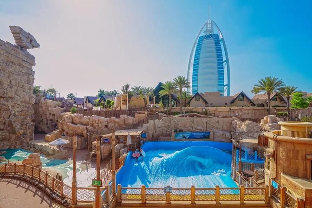 a water slide at a theme park with a tall building
