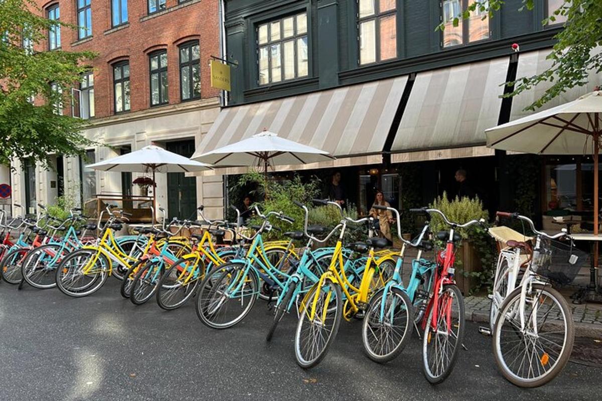 a row of bikes parked in front of a building