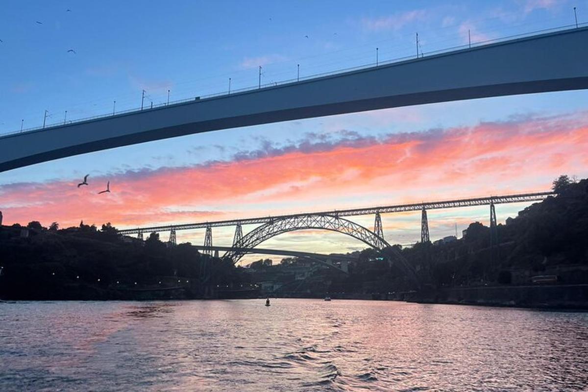 a bridge over a river with a bridge in the background