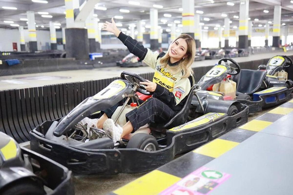 a woman is sitting in an empty go cart