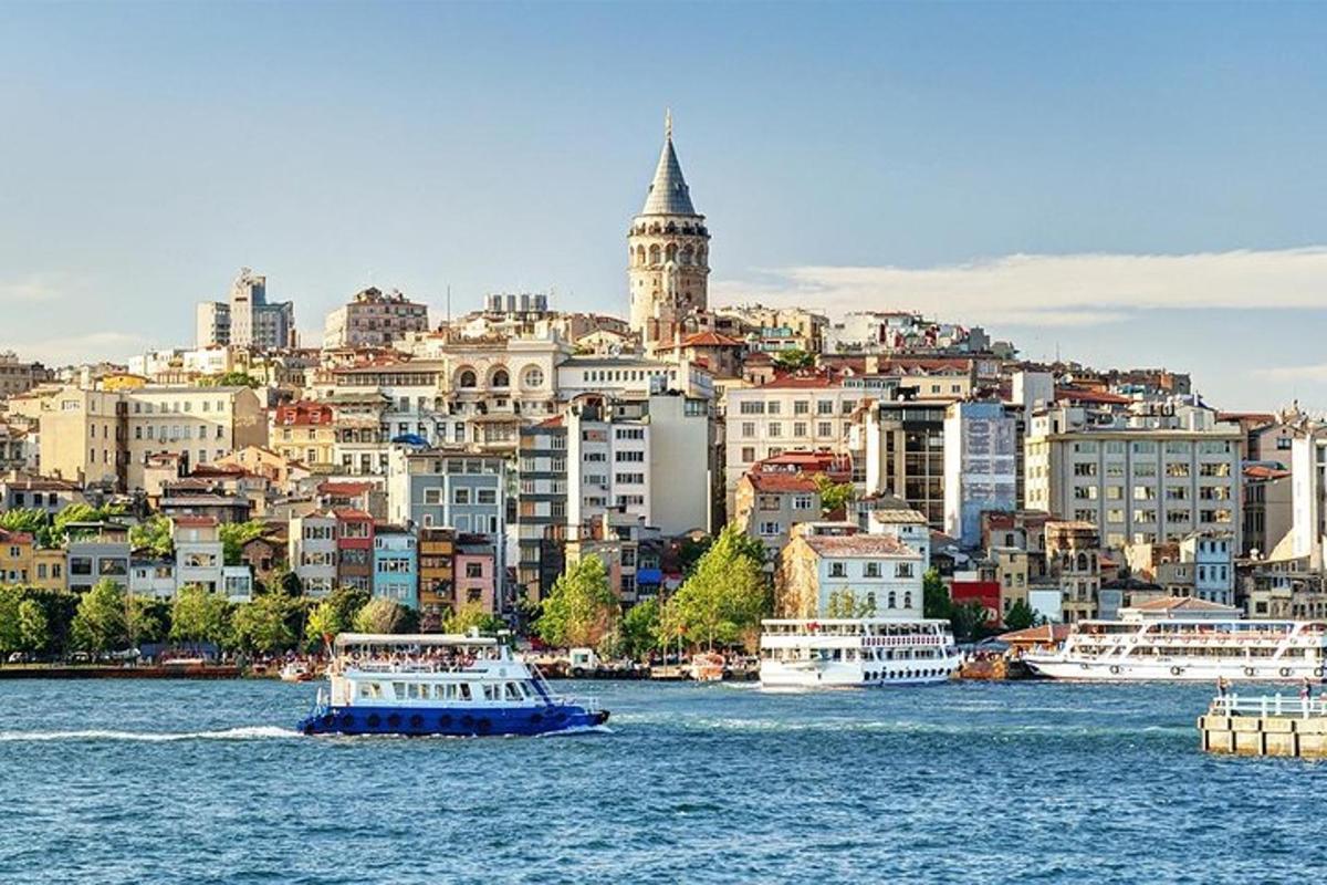 a view of a city from the water with boats