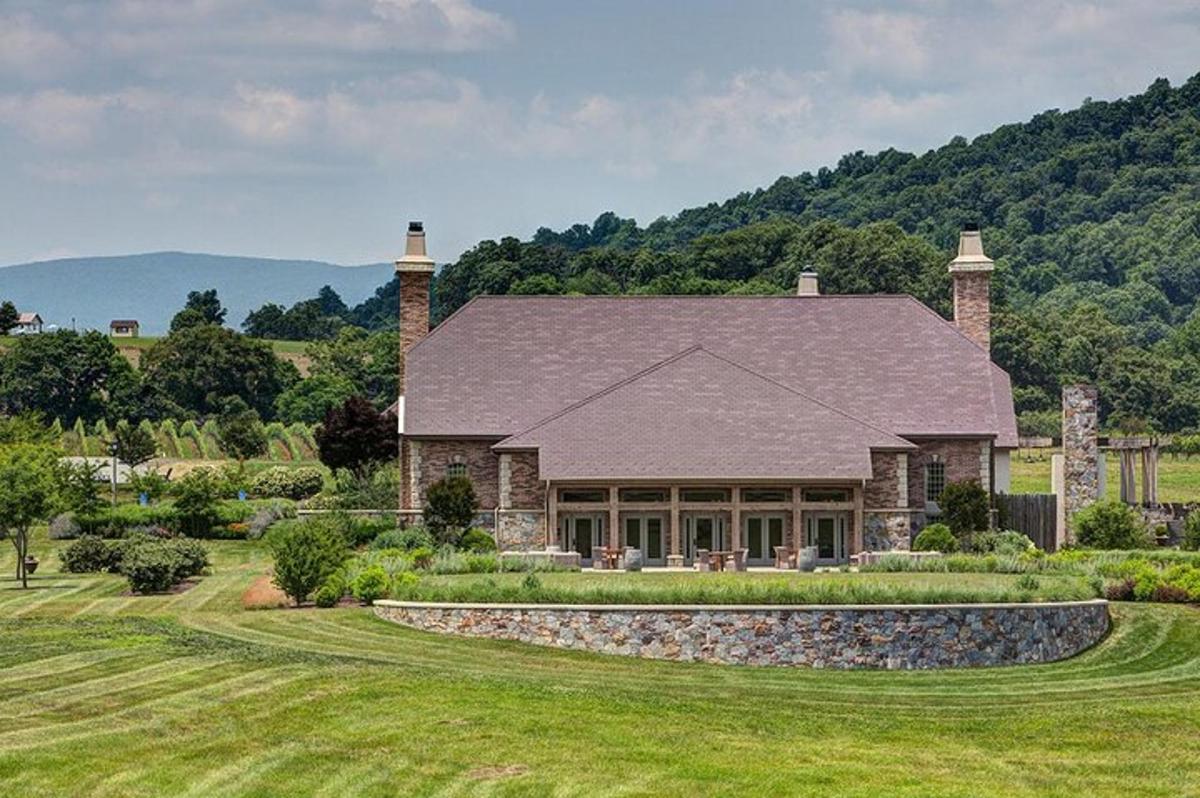 a large stone house with a large yard
