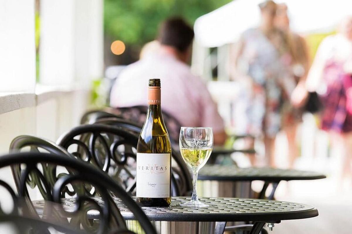 a bottle of wine sitting on a table with a glass