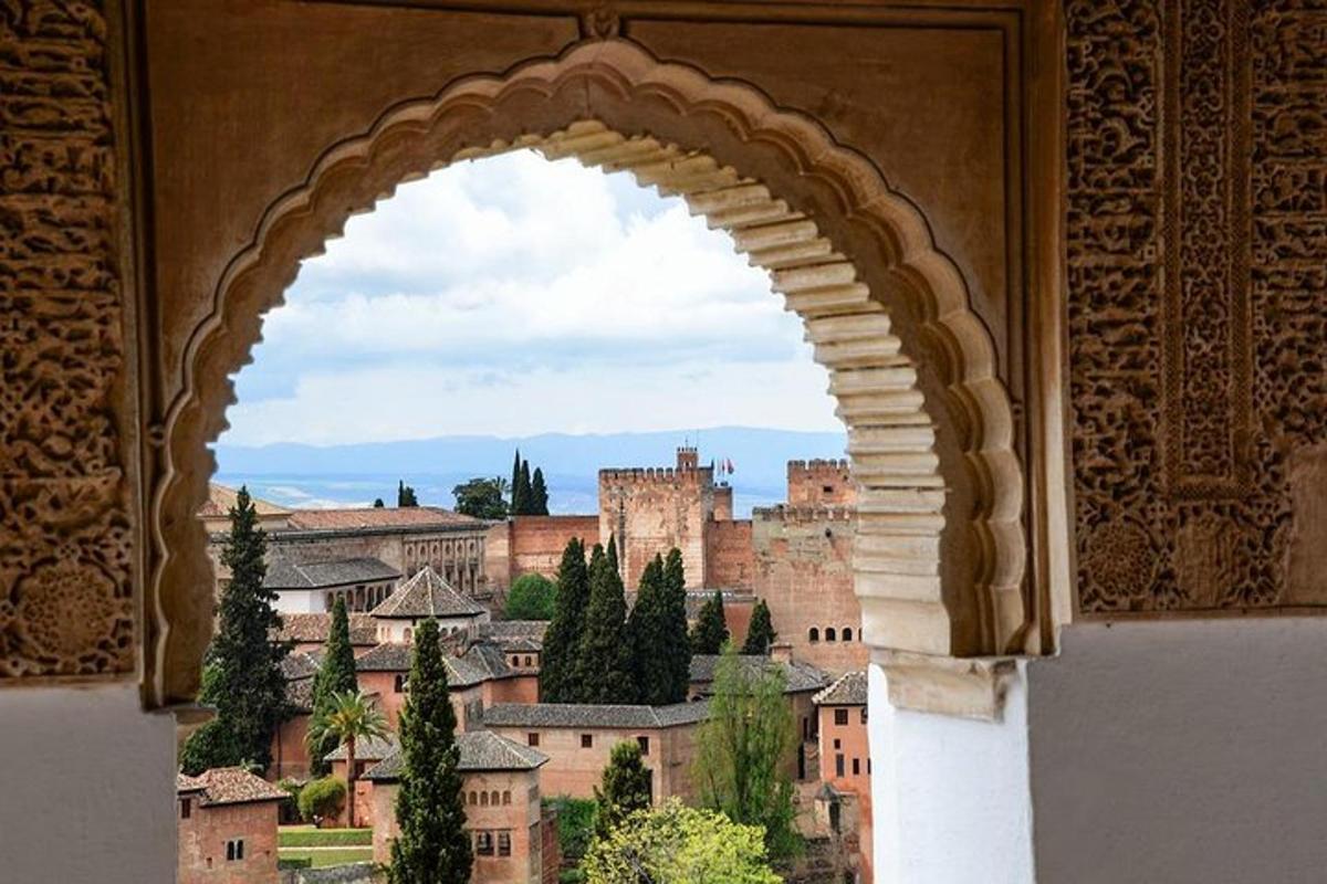an arch in a building with a view of a city