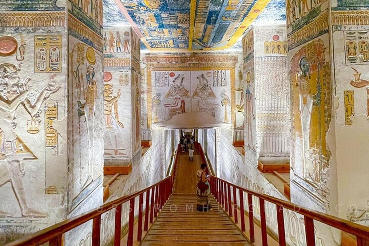 a hallway in a building with paintings on the walls