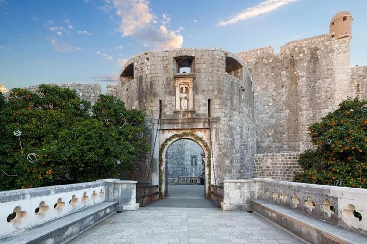 an entrance to a stone building with an archway