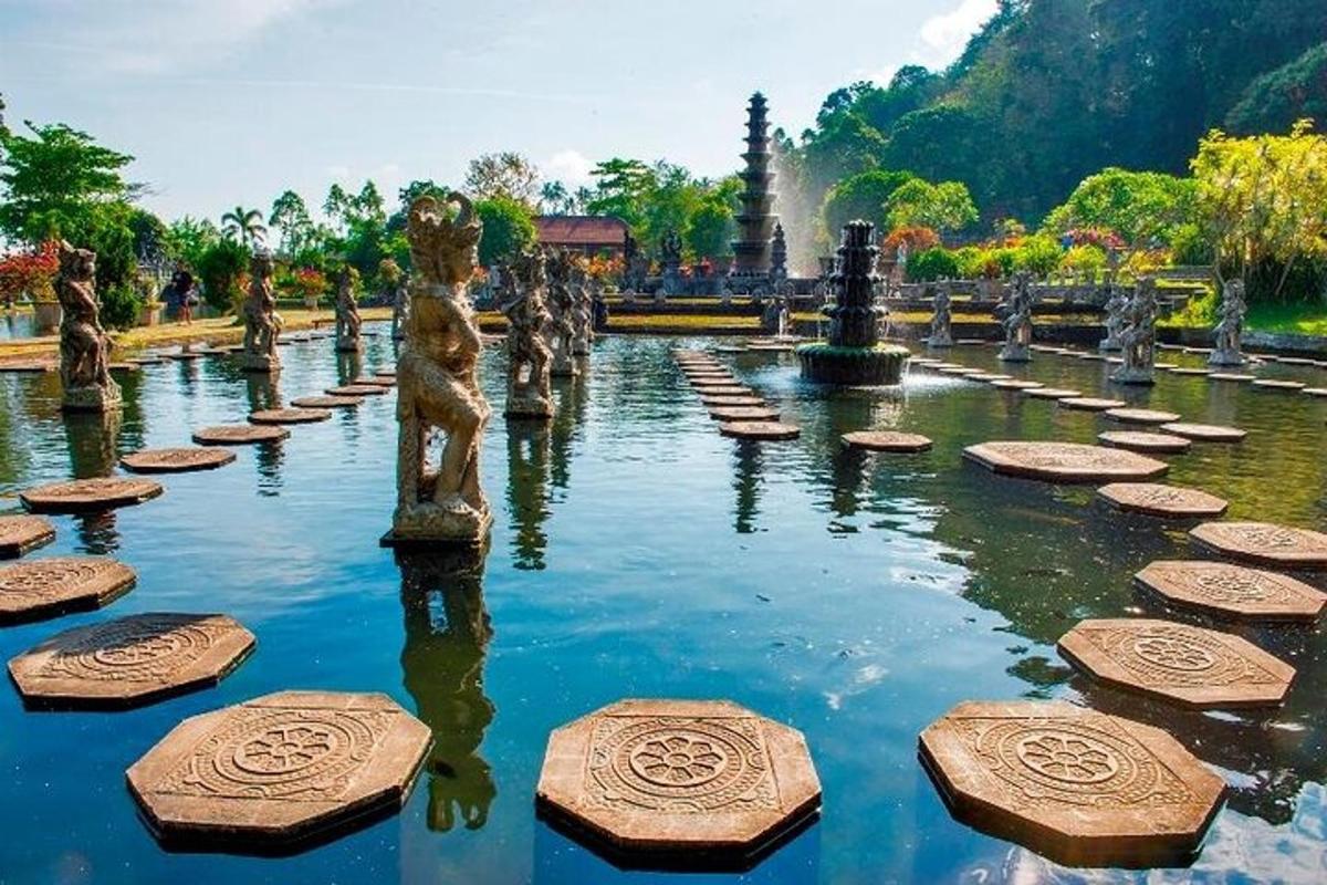 a fountain in a park with statues in the water
