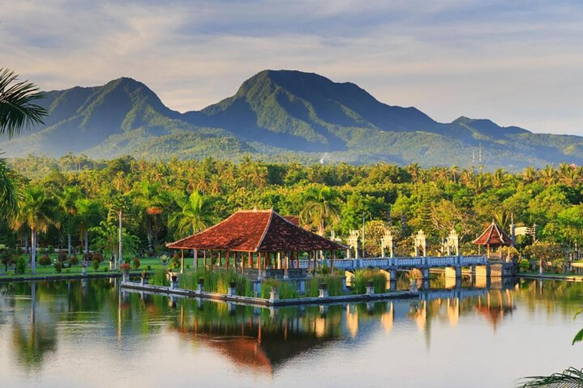 a resort on the water with mountains in the background