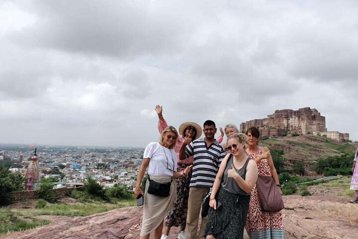 a group of people standing on top of a mountain