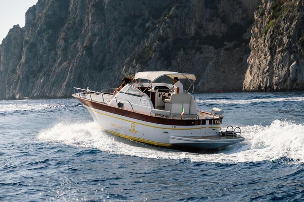 a boat in the water with two people on it