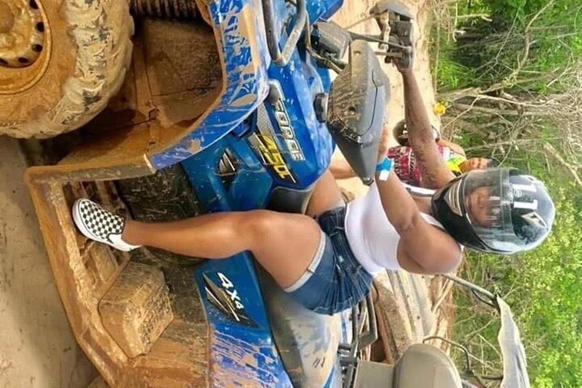 a woman is riding a bike on a zip line