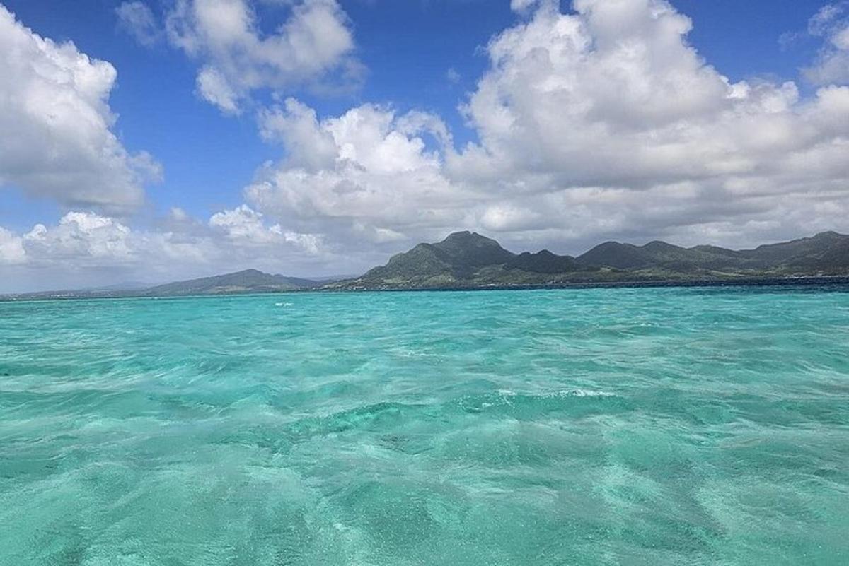 a large body of water with mountains in the background