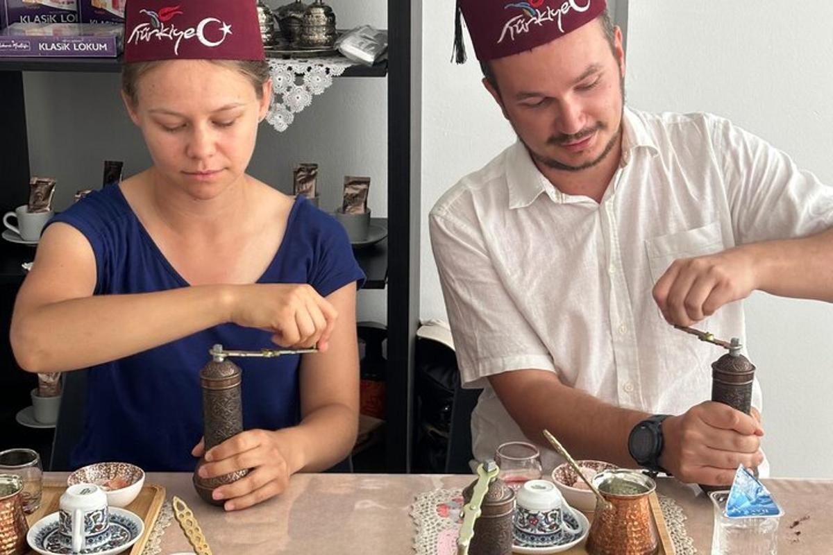 a man and a woman preparing food at a table