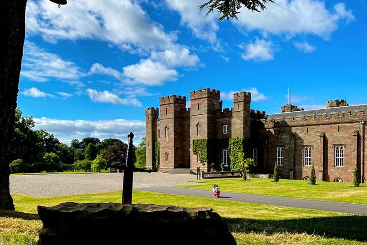 a castle with a girl standing in front of it