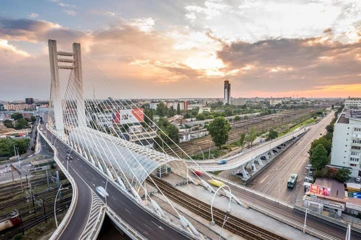 a bridge over a city with a train on it